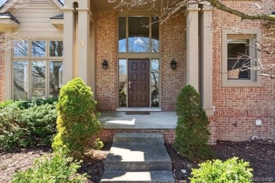 Step into this stunning 4-bedroom brick colonial located in the on Oakhurst Golf and Country Club in Michigan - for sale on GolfHomes.com, golf home, golf lot