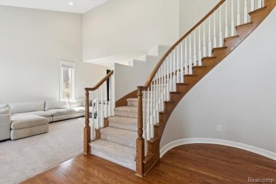 Step into this stunning 4-bedroom brick colonial located in the on Oakhurst Golf and Country Club in Michigan - for sale on GolfHomes.com, golf home, golf lot