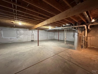 FABULOUS RANCHER WITH PARTIALLY FINISHED BASEMENT SHOWCASING AN on Desert Hawk At Pueblo West in Colorado - for sale on GolfHomes.com, golf home, golf lot
