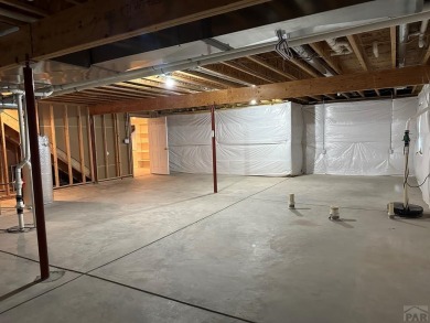 FABULOUS RANCHER WITH PARTIALLY FINISHED BASEMENT SHOWCASING AN on Desert Hawk At Pueblo West in Colorado - for sale on GolfHomes.com, golf home, golf lot