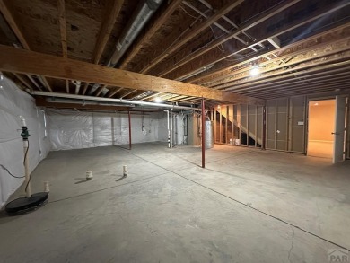 FABULOUS RANCHER WITH PARTIALLY FINISHED BASEMENT SHOWCASING AN on Desert Hawk At Pueblo West in Colorado - for sale on GolfHomes.com, golf home, golf lot