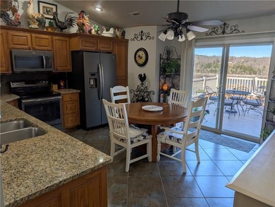 Enjoy stunning views of Table Rock Lake from the upper deck on Holiday Island Executive Golf Course in Arkansas - for sale on GolfHomes.com, golf home, golf lot