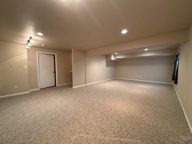 FABULOUS RANCHER WITH PARTIALLY FINISHED BASEMENT SHOWCASING AN on Desert Hawk At Pueblo West in Colorado - for sale on GolfHomes.com, golf home, golf lot