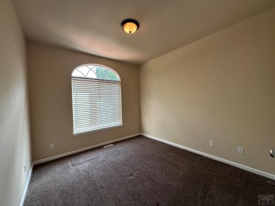 FABULOUS RANCHER WITH PARTIALLY FINISHED BASEMENT SHOWCASING AN on Desert Hawk At Pueblo West in Colorado - for sale on GolfHomes.com, golf home, golf lot