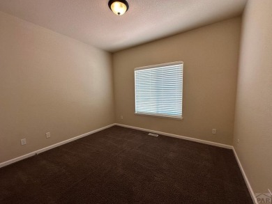 FABULOUS RANCHER WITH PARTIALLY FINISHED BASEMENT SHOWCASING AN on Desert Hawk At Pueblo West in Colorado - for sale on GolfHomes.com, golf home, golf lot