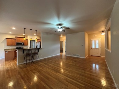 FABULOUS RANCHER WITH PARTIALLY FINISHED BASEMENT SHOWCASING AN on Desert Hawk At Pueblo West in Colorado - for sale on GolfHomes.com, golf home, golf lot