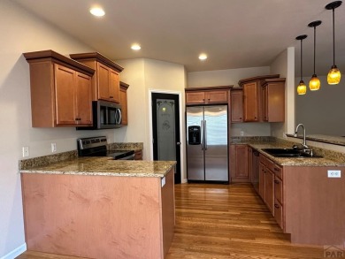 FABULOUS RANCHER WITH PARTIALLY FINISHED BASEMENT SHOWCASING AN on Desert Hawk At Pueblo West in Colorado - for sale on GolfHomes.com, golf home, golf lot