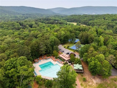 This amazing home with beautiful mountain views is nestled in a on The Highlands Course at Lake Arrowhead in Georgia - for sale on GolfHomes.com, golf home, golf lot