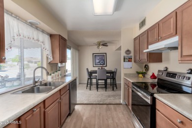 This lovely Sun City home is light & bright with an open concept on PalmBrook Country Club in Arizona - for sale on GolfHomes.com, golf home, golf lot