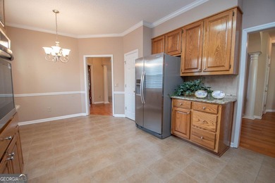 Welcome to this gorgeous brick Traditional with fabulous golf on Braelinn Golf Club in Georgia - for sale on GolfHomes.com, golf home, golf lot