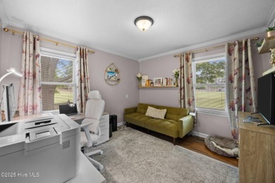 Discover this inviting brick ranch nestled on a serene .48-acre on River Bend Golf and Country Club in North Carolina - for sale on GolfHomes.com, golf home, golf lot