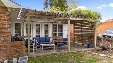 Discover this inviting brick ranch nestled on a serene .48-acre on River Bend Golf and Country Club in North Carolina - for sale on GolfHomes.com, golf home, golf lot