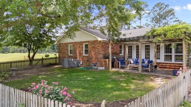 Discover this inviting brick ranch nestled on a serene .48-acre on River Bend Golf and Country Club in North Carolina - for sale on GolfHomes.com, golf home, golf lot