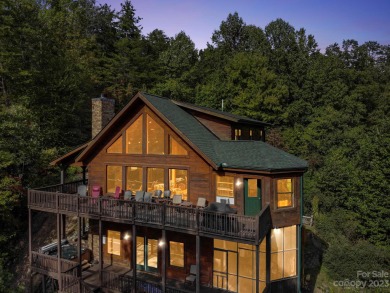 This magnificent log cabin boasting 3,200+ sq ft of heated on Rumbling Bald Resort on Lake Lure in North Carolina - for sale on GolfHomes.com, golf home, golf lot
