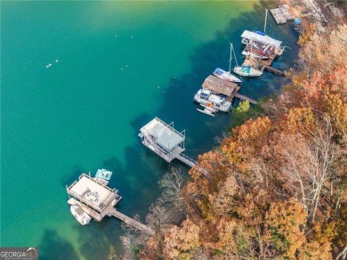 This stunning lakefront home on Lake Lanier offers effortless on Lanier Island Legacy Golf Couorse in Georgia - for sale on GolfHomes.com, golf home, golf lot