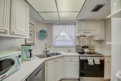 Terrific 55+ living! Extra bright end unit in popular Little on The Little Club in Florida - for sale on GolfHomes.com, golf home, golf lot