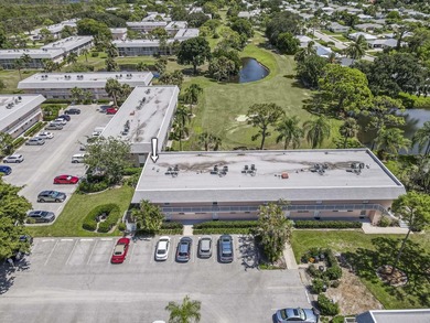 Terrific 55+ living! Extra bright end unit with beautiful golf on The Little Club in Florida - for sale on GolfHomes.com, golf home, golf lot