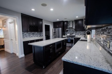Welcome to this beautifully updated single-family home in the on Stonebridge Golf Club in Michigan - for sale on GolfHomes.com, golf home, golf lot