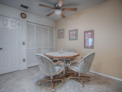 BOND PAID!  ROOF 2023! HVAC 2024!  WELL MAINTAINED COLONY PATIO on The Links of Spruce Creek in Florida - for sale on GolfHomes.com, golf home, golf lot