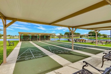 This home in a gated Golf Course community with no mandatory on Cypress Lakes Golf Course - West Palm Beach in Florida - for sale on GolfHomes.com, golf home, golf lot