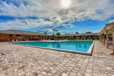 This home in a gated Golf Course community with no mandatory on Cypress Lakes Golf Course - West Palm Beach in Florida - for sale on GolfHomes.com, golf home, golf lot