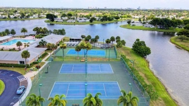 This home in a gated Golf Course community with no mandatory on Cypress Lakes Golf Course - West Palm Beach in Florida - for sale on GolfHomes.com, golf home, golf lot