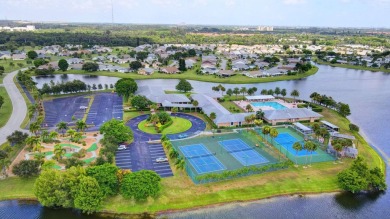 This home in a gated Golf Course community with no mandatory on Cypress Lakes Golf Course - West Palm Beach in Florida - for sale on GolfHomes.com, golf home, golf lot