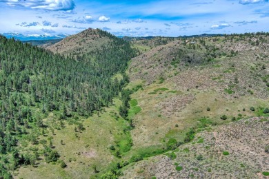 With mostly pines, aspens and rock outcroppings, this property on Fox Acres Country Club in Colorado - for sale on GolfHomes.com, golf home, golf lot