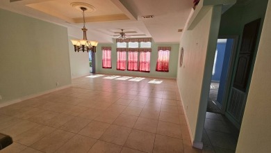 This home is being sold -AS IS - and is located on a quiet on The Riverside Golf Club in Florida - for sale on GolfHomes.com, golf home, golf lot