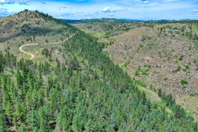 With mostly pines, aspens and rock outcroppings, this property on Fox Acres Country Club in Colorado - for sale on GolfHomes.com, golf home, golf lot