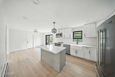 Nestled on over half an acre in the tranquil, amenity-rich on Lords Valley Country Club, Inc in Pennsylvania - for sale on GolfHomes.com, golf home, golf lot