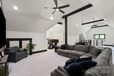 Exceptional home in The Point with fantastic indoor & outdoor on Trump National Golf Club Charlotte in North Carolina - for sale on GolfHomes.com, golf home, golf lot