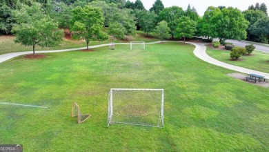 Welcome to a home that blends warmth, comfort, and community in on Hamilton Mill Golf Club in Georgia - for sale on GolfHomes.com, golf home, golf lot