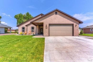 Nestled in the picturesque Cattails Golf Course community in on Cattails Golf Club in Colorado - for sale on GolfHomes.com, golf home, golf lot