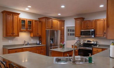 You're invited to experience a home where elegance feels on The Esquire Country Club in West Virginia - for sale on GolfHomes.com, golf home, golf lot