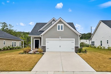 Experience refined coastal living in the prestigious Isles of on River Oaks Golf Plantation  in South Carolina - for sale on GolfHomes.com, golf home, golf lot