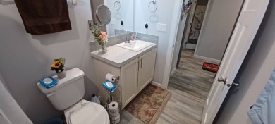 Come settle down and relax in a beautiful, manufactured home on Fairways Country Club in Florida - for sale on GolfHomes.com, golf home, golf lot