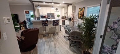 Come settle down and relax in a beautiful, manufactured home on Fairways Country Club in Florida - for sale on GolfHomes.com, golf home, golf lot