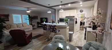 Come settle down and relax in a beautiful, manufactured home on Fairways Country Club in Florida - for sale on GolfHomes.com, golf home, golf lot