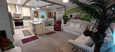 Come settle down and relax in a beautiful, manufactured home on Fairways Country Club in Florida - for sale on GolfHomes.com, golf home, golf lot