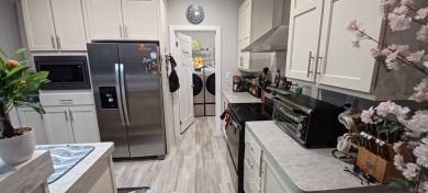 Come settle down and relax in a beautiful, manufactured home on Fairways Country Club in Florida - for sale on GolfHomes.com, golf home, golf lot