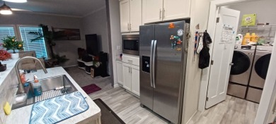 Come settle down and relax in a beautiful, manufactured home on Fairways Country Club in Florida - for sale on GolfHomes.com, golf home, golf lot