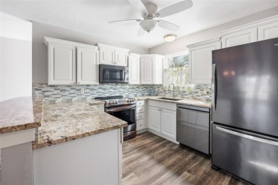 This open floor plan Laredo offers the kind of privacy that's on Glenview Championship Golf and Country Club in Florida - for sale on GolfHomes.com, golf home, golf lot