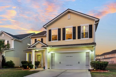 This beautiful two-story home is nestled on a pond-front lot in on Cypress Point Par 3 in South Carolina - for sale on GolfHomes.com, golf home, golf lot