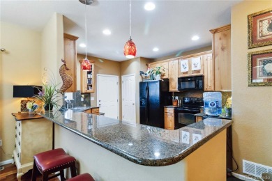 Welcome to this spacious ranch-style townhome near Buffalo Run on Buffalo Run Golf Course in Colorado - for sale on GolfHomes.com, golf home, golf lot