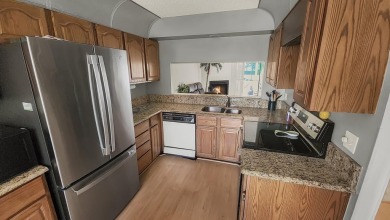 Unlock the potential of this spacious three-bedroom/two and half on PGA National Golf Club in Florida - for sale on GolfHomes.com, golf home, golf lot