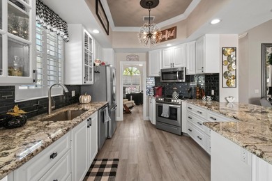 This lovely updated home offers stunning lake views, on a on Lost Lake Golf Club in Florida - for sale on GolfHomes.com, golf home, golf lot