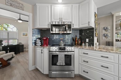 This lovely updated home offers stunning lake views, on a on Lost Lake Golf Club in Florida - for sale on GolfHomes.com, golf home, golf lot