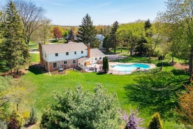 Welcome to this stunning, elegantly updated colonial nestled in on Hilltop Golf Course in Michigan - for sale on GolfHomes.com, golf home, golf lot