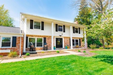Welcome to this stunning, elegantly updated colonial nestled in on Hilltop Golf Course in Michigan - for sale on GolfHomes.com, golf home, golf lot